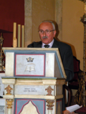 Provincia.El Profesor e Historiador D. Manuel Morales Morales, pronuncio una disertación, sobre el canto de la Sentencia de Pilatos en la Hermandad de Jesús Nazareno de Alcalá del Río.